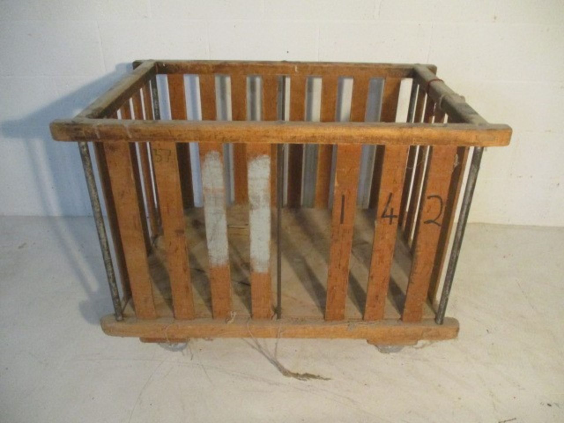 A slatted wooden industrial bobbin trolley, 109 cm x 70 cm