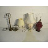 A collection of four various table lamps