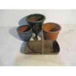 Three garden pots, along with a wooden trug and metal statue