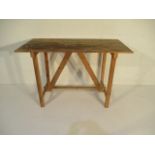 A trestle style wooden workbench