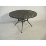 A circular metal garden table