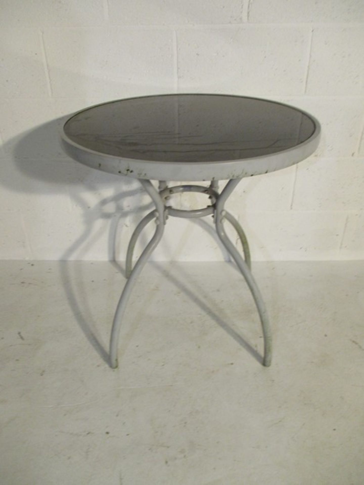 A modern round garden bistro table