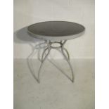 A modern round garden bistro table