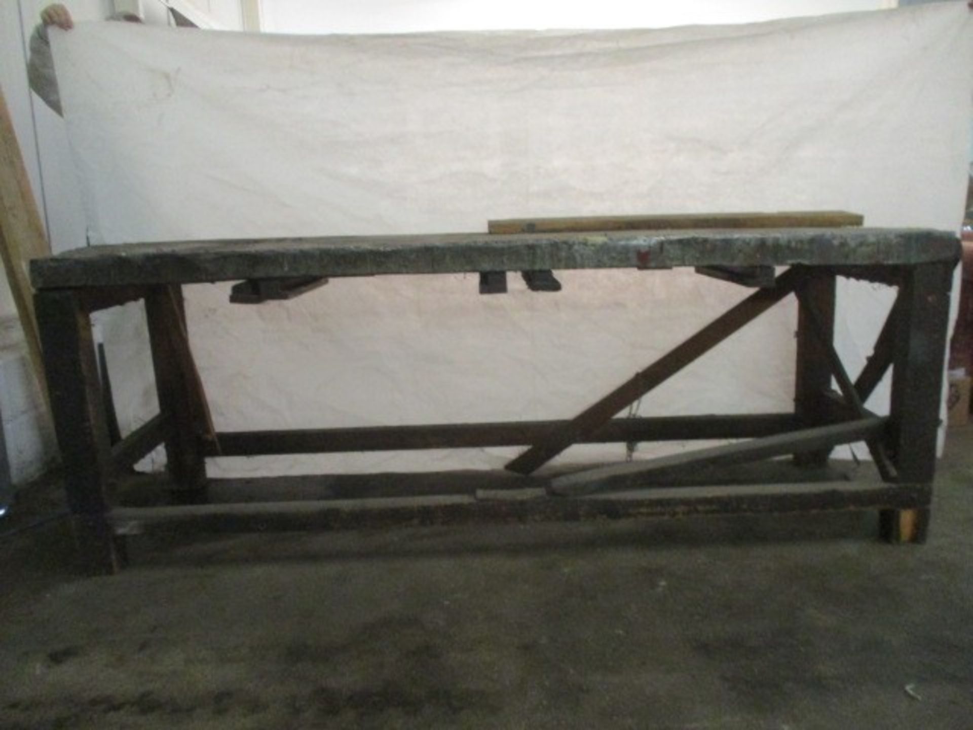 A large industrial workbench with metal covered top. Length 231cm Width 76cm Height 84cm.