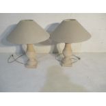 A pair of stone effect lamps