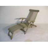 A large wooden folding garden lounger