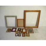 A collection of various sized picture frames