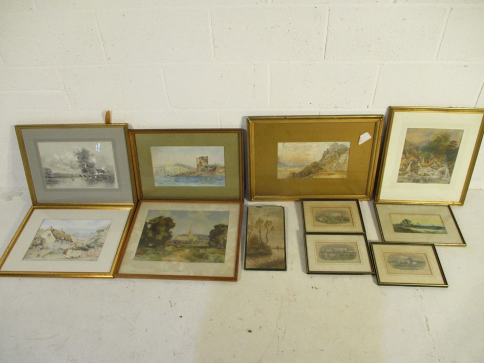 A collection of framed watercolours, prints etc, including a watercolour of cottages by G.Miller & a