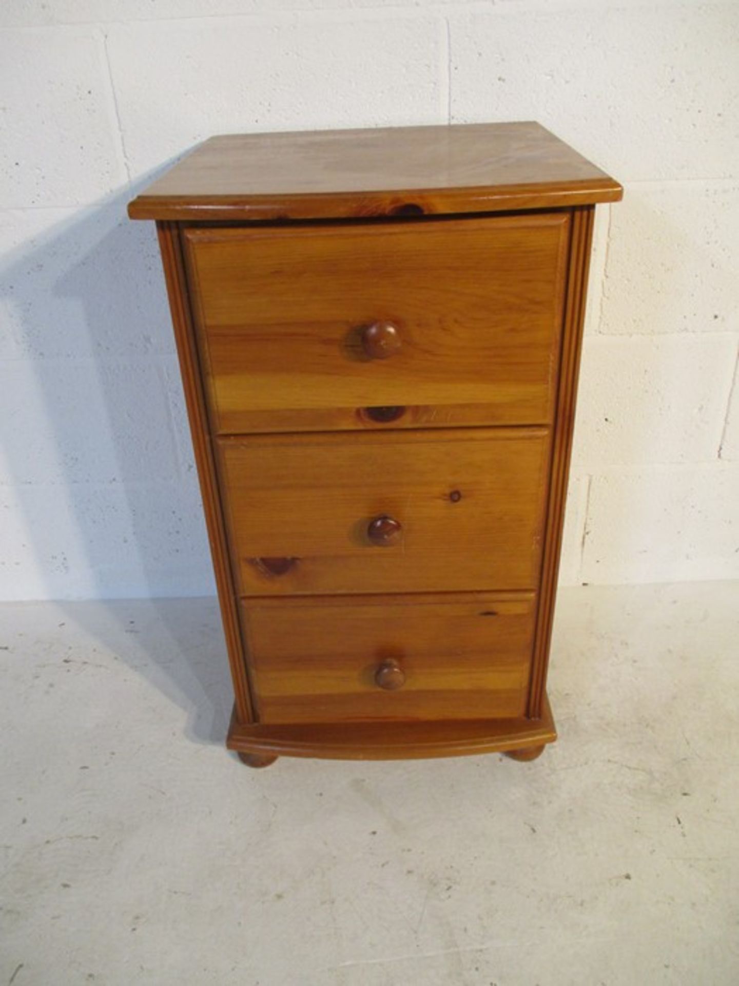 A pine chest of three drawers, height 78cm