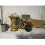 A brass vase, a collection of vintage beer mats, glass floats, a brass vase, a 1940s Heroes of the