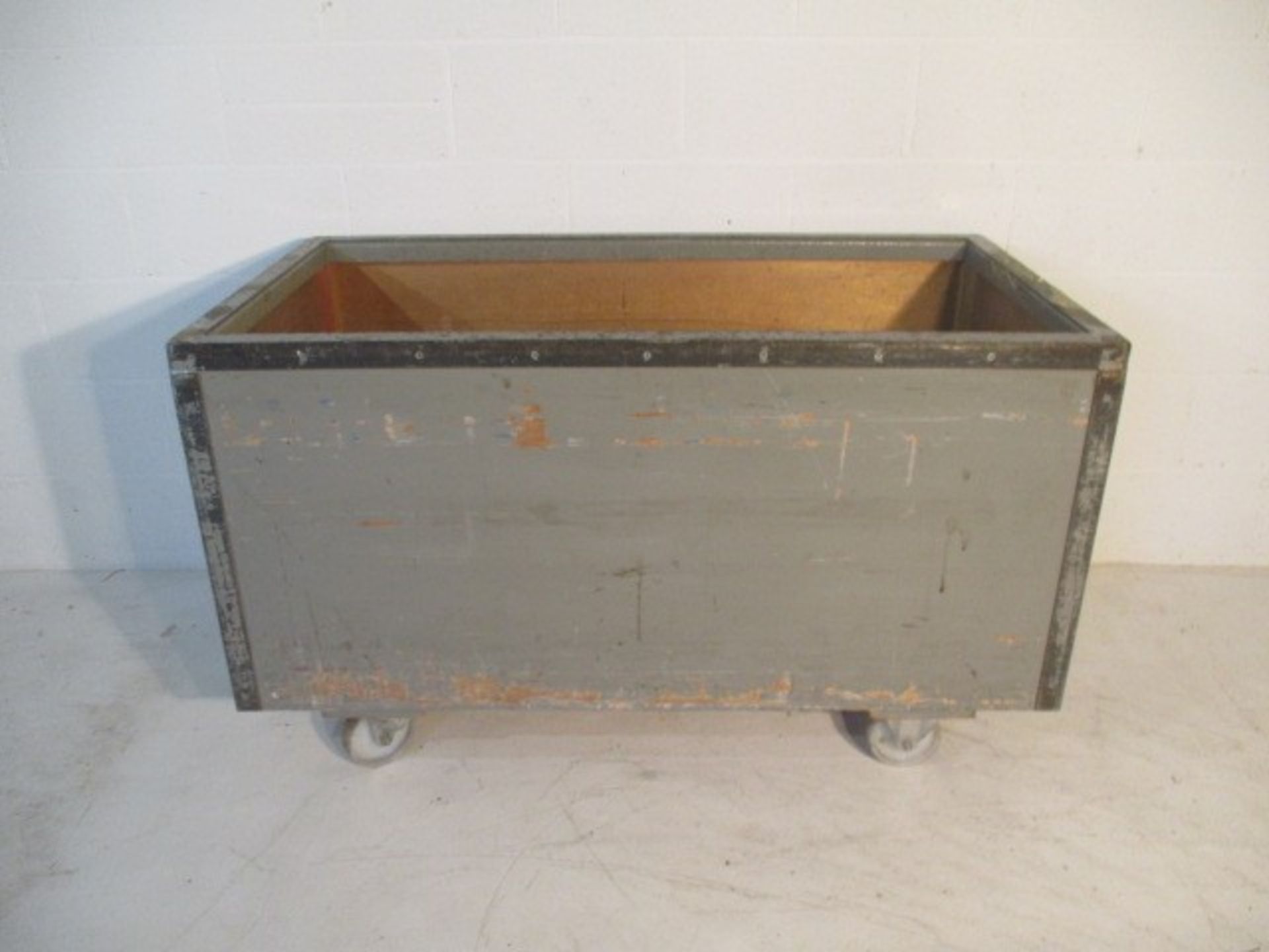 A grey painted trolley with metal edging, 133 cm x 71 cm
