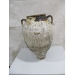 A terracotta well weathered urn - height approx. 59cm