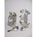 A pair of Royal Copenhagen bluebirds along with two Lladro figurines