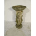 A concrete birdbath with three semi-nude ladies on base - height 80cm