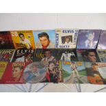 A collection of Elvis Presley vinyl records including Elvis Greatest Hits double special pink