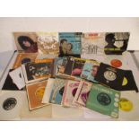 A collection of 7" vinyl records including Marc Bolan, The Beatles, The Bee Gees, Cliff Richard, The