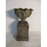 A concrete garden urn on plinth - overall height 94cm