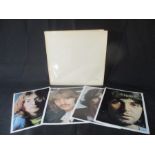 The Beatles White Album (Numbered 0212775), together with four photographs and poster,