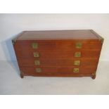 An Oriental teak chest of eight drawers L153cm H87cm D61cm