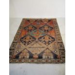 An Iranian "Lori" red ground rug - length 230cm, width 169cm