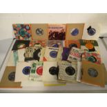 A collection of 7" vinyl records including Donovan, The Hollies, Cliff Richard, UB40, The Searchers,
