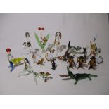 A collection of glass animals including dogs, cats, crocodile, horse, three wise monkeys etc