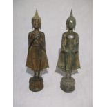 A pair of bronze standing Buddha's, height 57 cm