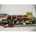 A collection of double OO gauge freight cargo rolling stock, accessories and track. Includes Hornby,