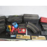 A vintage Scalextric set including one car, four controllers, power pack, lap counter, track etc -