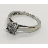 An 18ct white gold diamond cluster ring