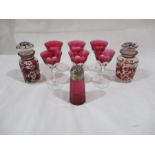 A set of six Victorian bohemian glasses, along with two bohemian glass storage jars and shaker