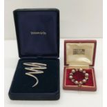 A boxed sterling silver brooch by Tiffany & Co along with a Mikimoto brooch (no pin)