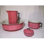An Art Deco pink toilet set by Cauldon comprising of a jug, bowl, chamber pot and soap dish