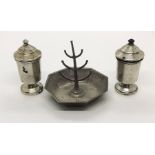 A hallmarked silver ring holder along with a pair of silver salt and pepper pots