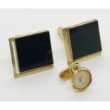 A pair of 14ct gold and onyx cufflinks along with a 14ct gold and onyx shirt stud, total weight 11.