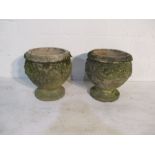 A pair of concrete garden urns - one repaired, height 39cm