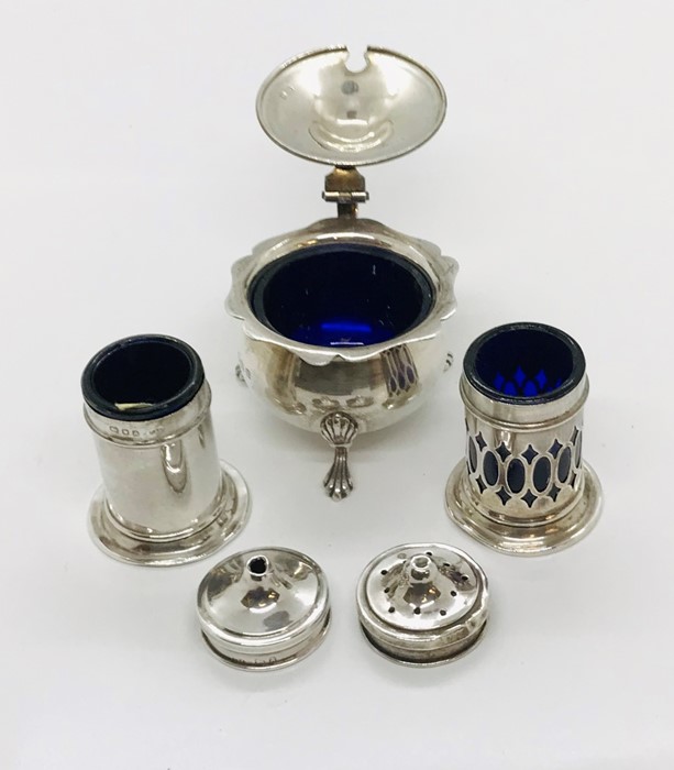 A hallmarked silver mustard pot with blue glass lining, along with silver salt and pepper pots - Image 2 of 2