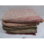 A collection of three vintage bed spreads