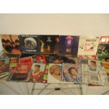 A collection of 12" vinyl records from 1960's artists, including The Beatles, The Rolling Stones,