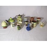 A collection of Torquay Ware including a small teapot, jugs, sugar shaker, egg cup etc