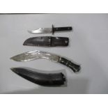 A kukri in leather scabbard including two karda knives, plus one other knife in a leather sheaf. The