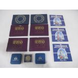 A collection of commemorative coins and Royal Mint coin sets