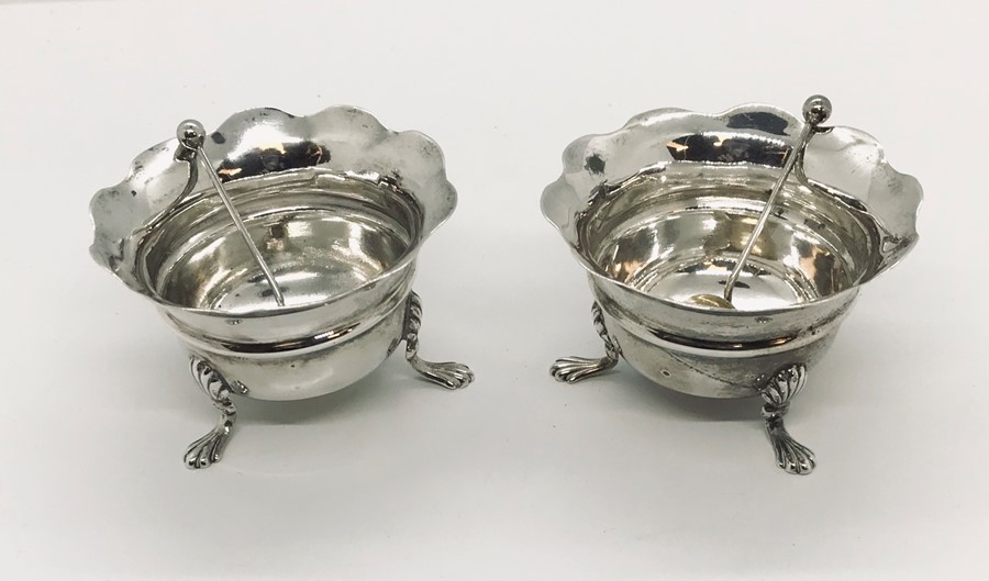 A pair of hallmarked silver salts and spoons