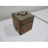 A turn of the century electric shock machine in a mahogany case