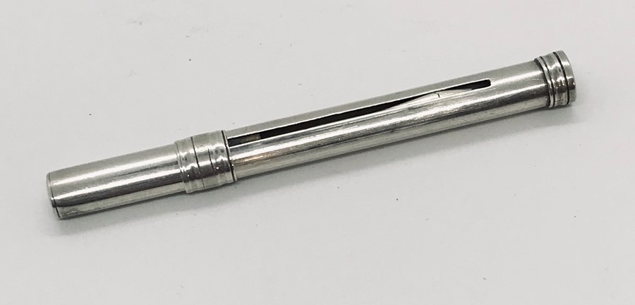 A hallmarked silver extendable toothpick, E. Barker 1950