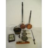 A collection of copperware along with a key cabinet, thermometer, egg timers etc