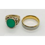 A 9ct gold signet ring with pierced decoration around an emerald coloured stone along with a