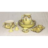 A decorative jug and bowl set ( hairline crack in jug) with assorted matching pieces