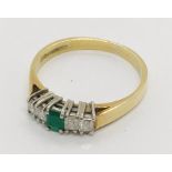 An 18ct gold diamond and emerald five stone ring