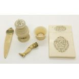 A late 19th century ivory card case, pepperette (A/F) and pipe tamper in the form of a leg (A/F)